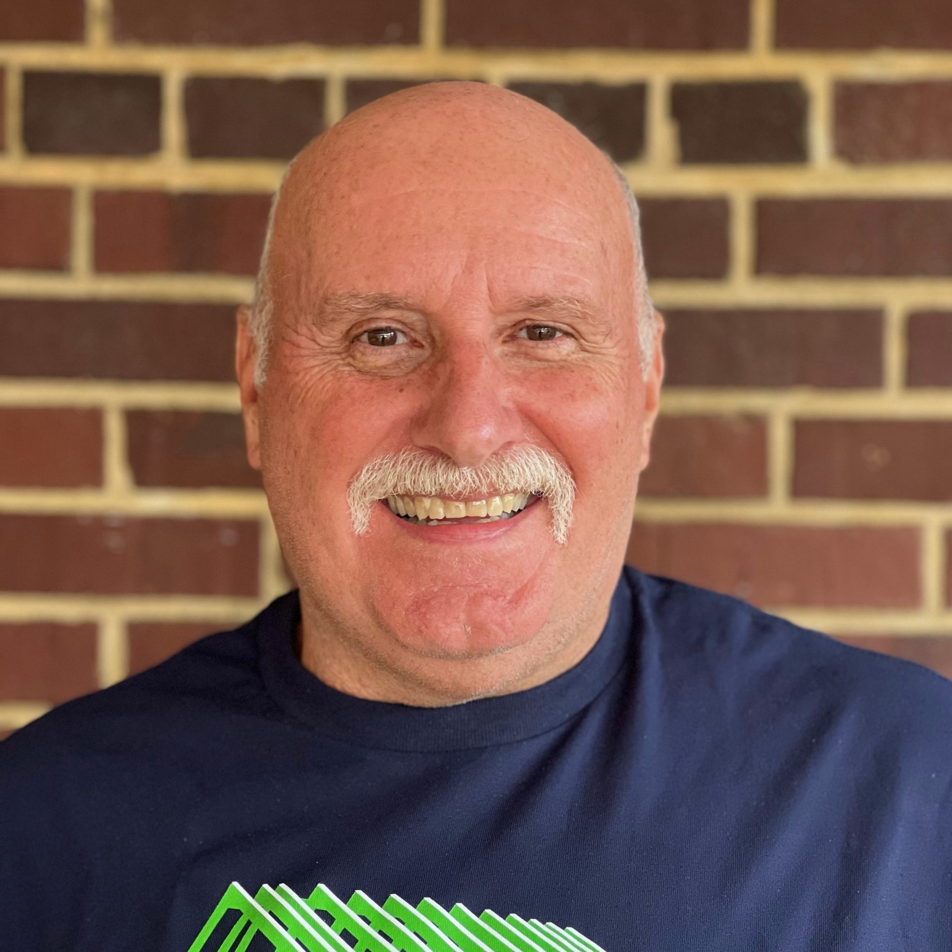 Head shot of Terry Whitesell wearing a blue shirt